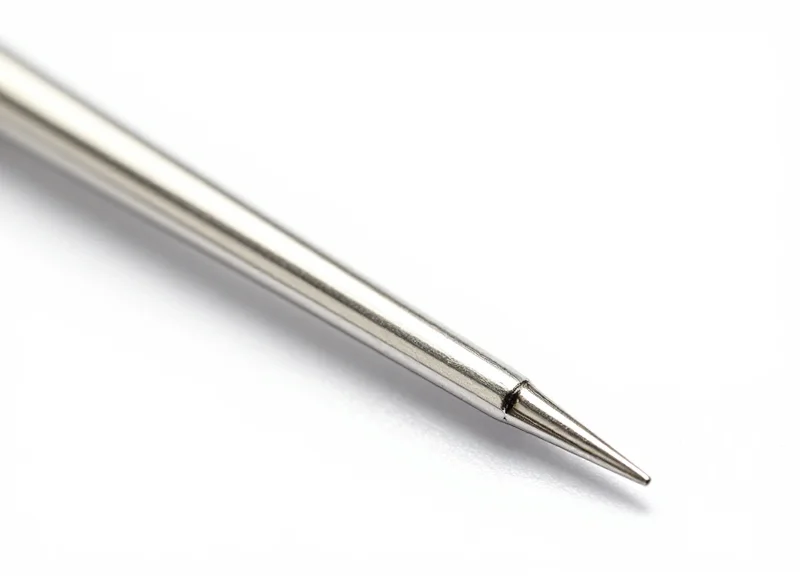 Macro photography of a specialized 15mm fine-needle EAS pin showing its smooth surface and ultra-thin profile.