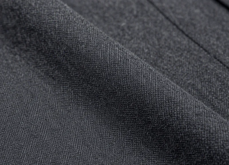 Macro detail of high-quality suit fabric weave.