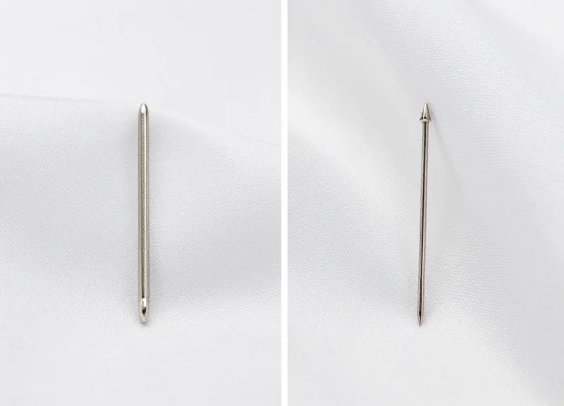 Comparison between a standard EAS pin and a 0.5mm fine pin on silk fabric