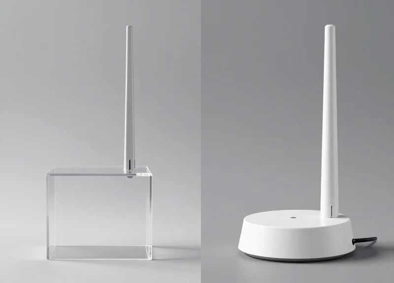 Two different types of EAS pedestals, one acrylic and one metallic, shown side-by-side for comparison.