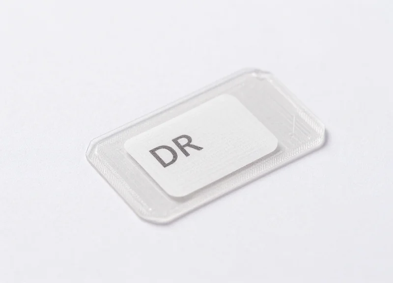 A macro shot of a small security DR label on a medicine package.