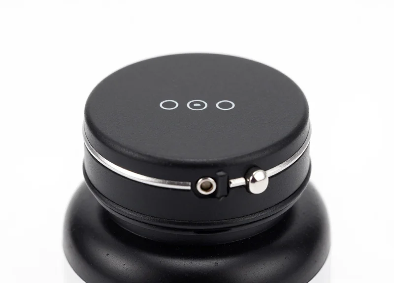 A close-up view of a specialized security cap designed for supplement bottles, highlighting its industrial lock mechanism.