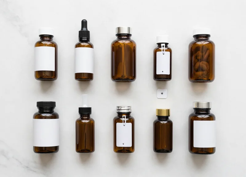 Flat lay of luxury cosmetics and healthcare supplements with discrete security tags