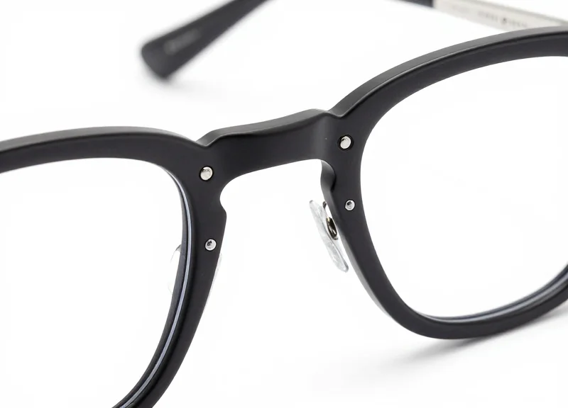 A minimalist view of a designer frame with a tiny, discreet security sensor.