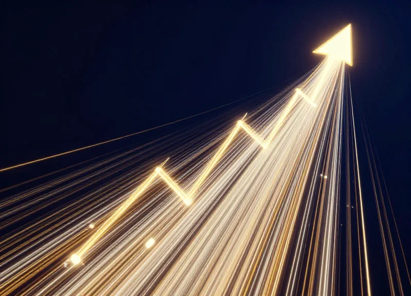 Upward trending light trails representing financial ROI growth and success.