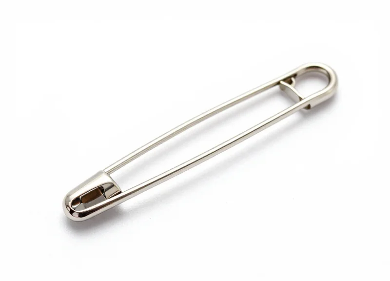 Specialized ultra-fine security pin designed for delicate clothing on a white background.