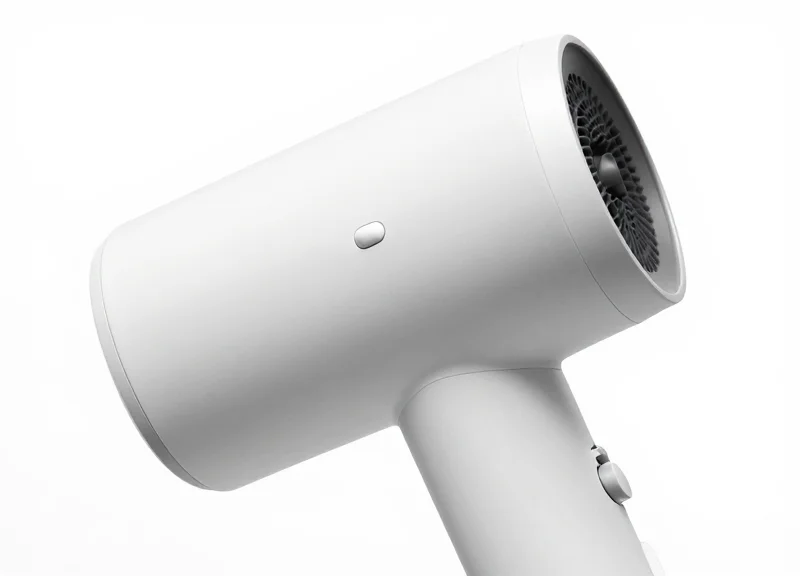 A small security sensor mounted on a curved hair dryer handle
