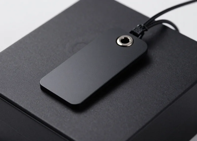 Close up of a modern electronic article surveillance security tag on a product box.