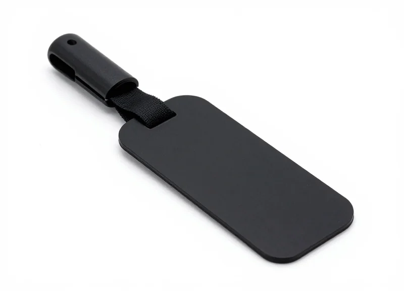 A slender pencil security hard tag for garments on a white background.
