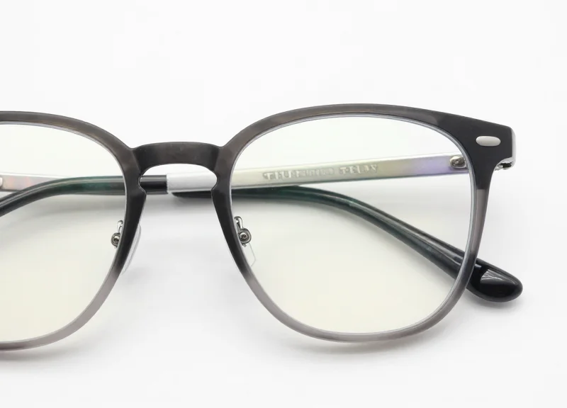 Close-up of a security tag safely attached to a pair of glasses frame.