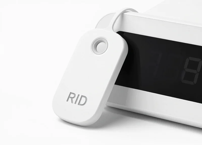 A high-tech RFID security tag and an electronic shelf label displayed on a clean white background.