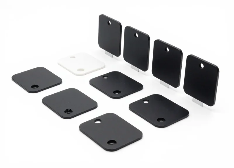 A professional product shot of various industrial RFID tags and sensors.