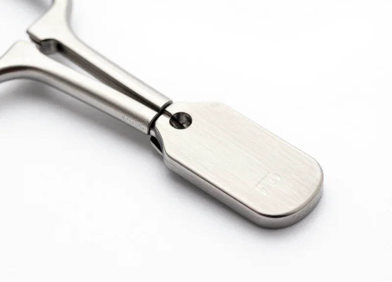 A close-up of a durable, heat-resistant RFID tag attached to a surgical instrument.