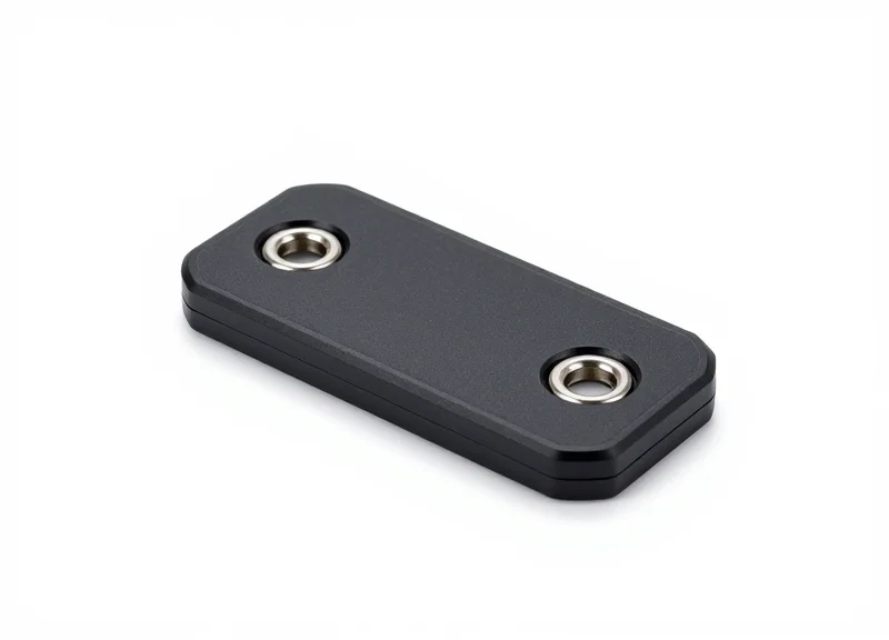 A modern heavy-duty industrial RFID tag with a ruggedized shell and metallic mounting holes.