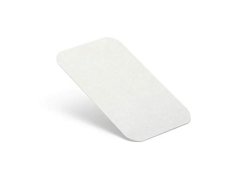 A flexible RFID tag with adhesive backing on a white background.