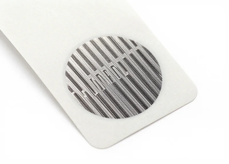 High-security tamper-evident RFID sticker tag for currency bags on a white background.