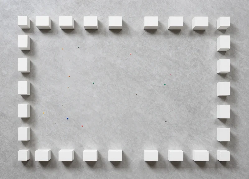 A flat lay of a minimalist gallery floor plan with organizational elements.