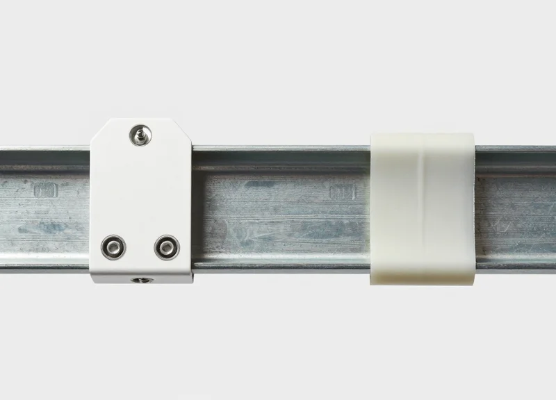Side-by-side comparison of RFID tags mounted using mechanical fasteners versus industrial adhesive on a metal surface.