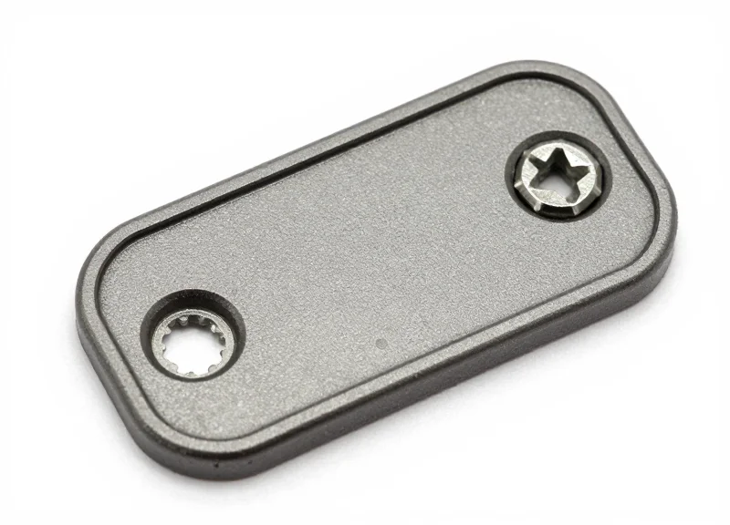 A heavy-duty industrial bolt-on RFID tag with screw holes on a white background.