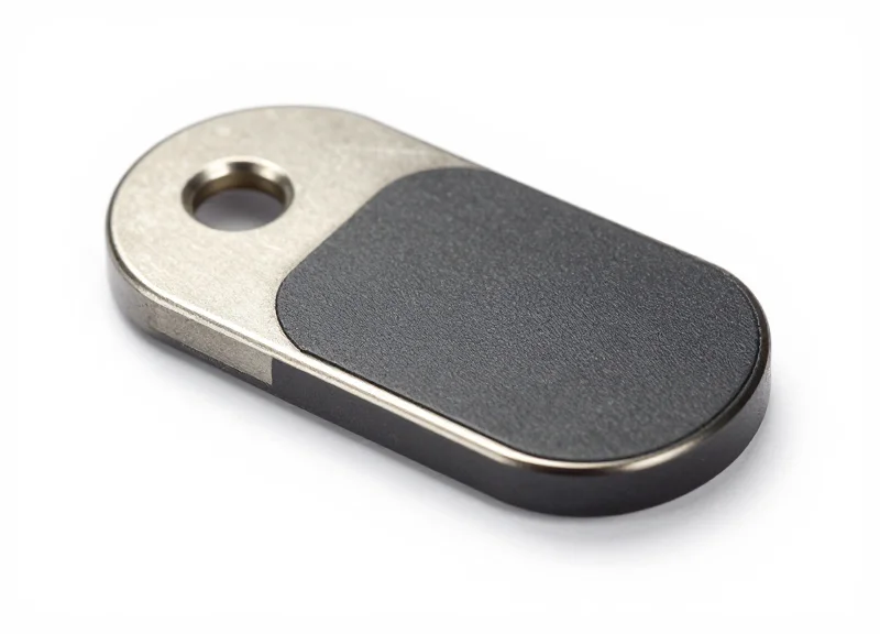 A close-up shot of an industrial-grade specialty RFID tag showing its rugged metallic and composite construction.