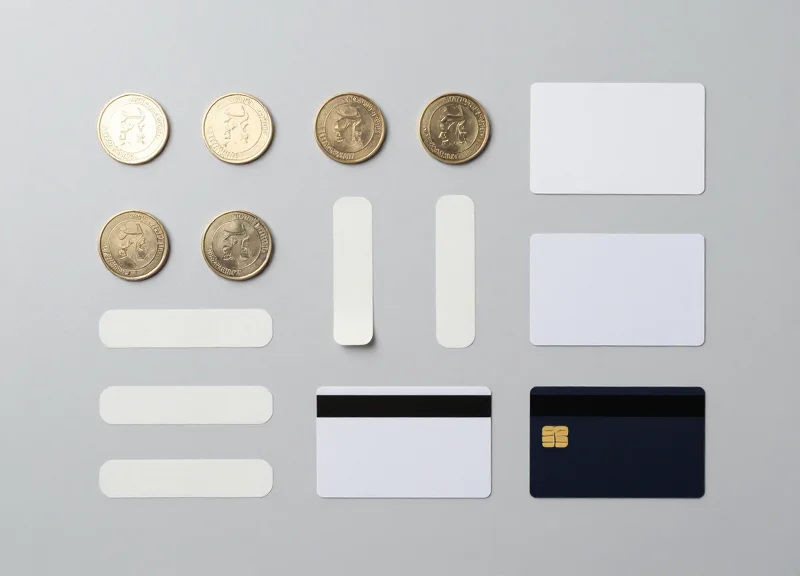 Various RFID sensor tag form factors including cards, stickers, and hard tags organized on a desk