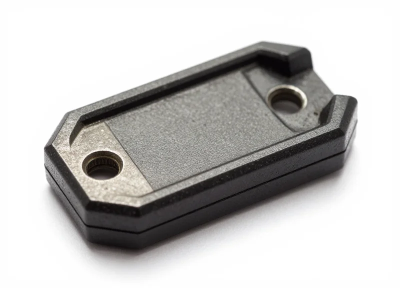A ruggedized industrial RTLS tag designed for mounting on metal surfaces.