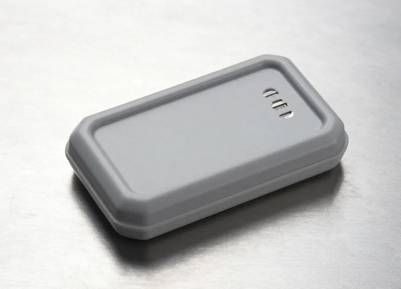 A high-performance rugged on-metal RFID tag displayed on a clean surface.