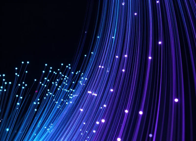Abstract data visualization showing high-speed glowing light streams flowing upwards, representing real-time retail insights.