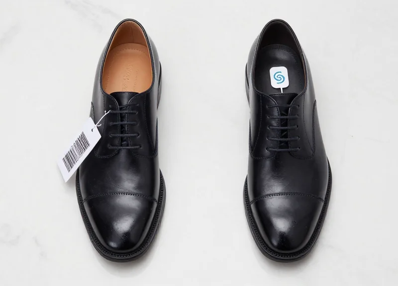 Side-by-side comparison of a traditional barcode and a modern RFID tag on luxury leather shoes