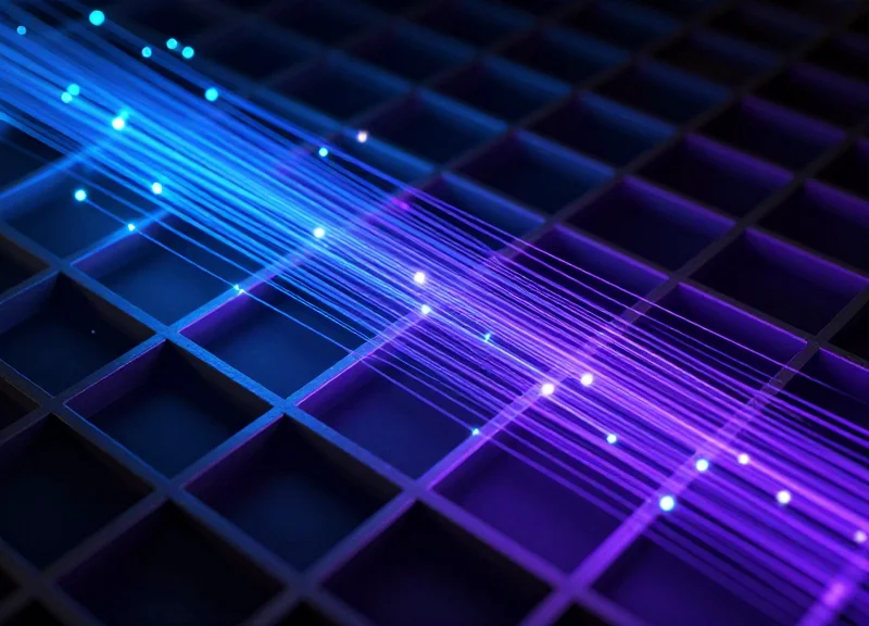 Abstract visualization of wireless signals and data streams moving through a complex metallic structure.
