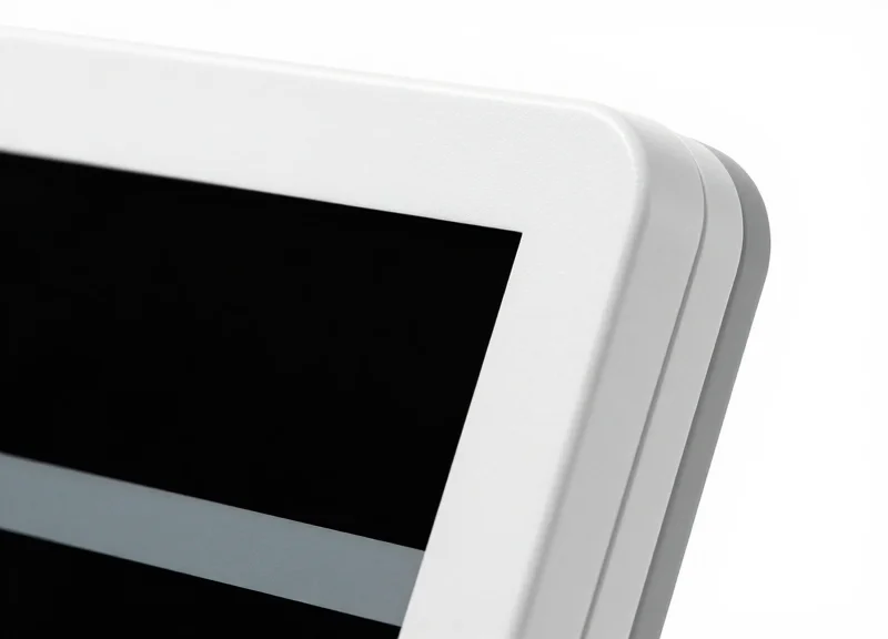 Macro shot of a medical-grade electronic shelf label showing its sealed, waterproof construction and smooth finish.